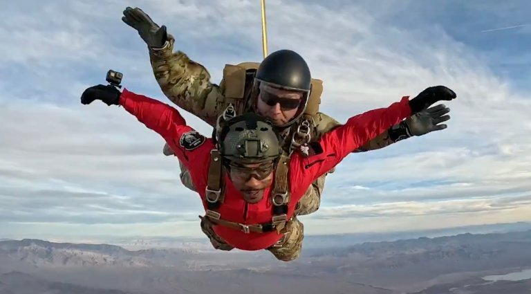 Actor Anthony Mackie, who plays Captain America, flies as the passenger of a tandem freefall jump with an Air Force pararescue tandem master at Nellis Air Force Base, Nevada.