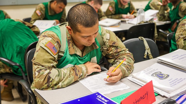 Students in the academic track of the U.S. Army’s Future Soldier Preparatory Course work on improving their math skills during a class at Fort Moore, Georgia. The academic track focuses on improving word knowledge, reading comprehension, arithmetic reasoning, and test-taking skills to help students improve their Armed Services Vocational Aptitude Battery (ASVAB) scores and meet the Army’s enlistment standards. (U.S. Army photo by Toygar Ayla)
